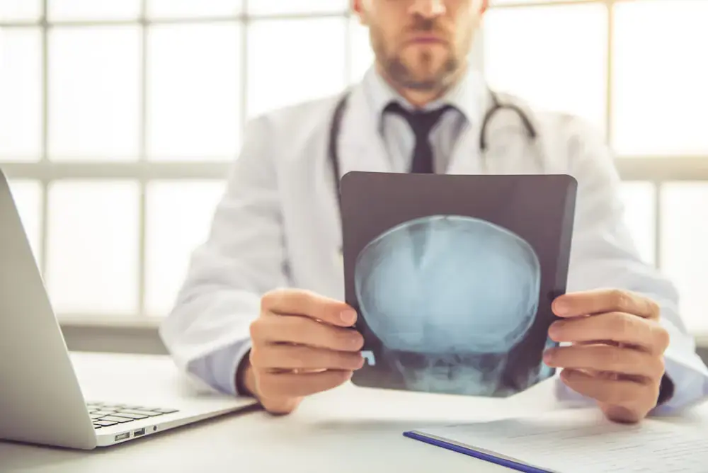 A doctor examining the results of an MRI