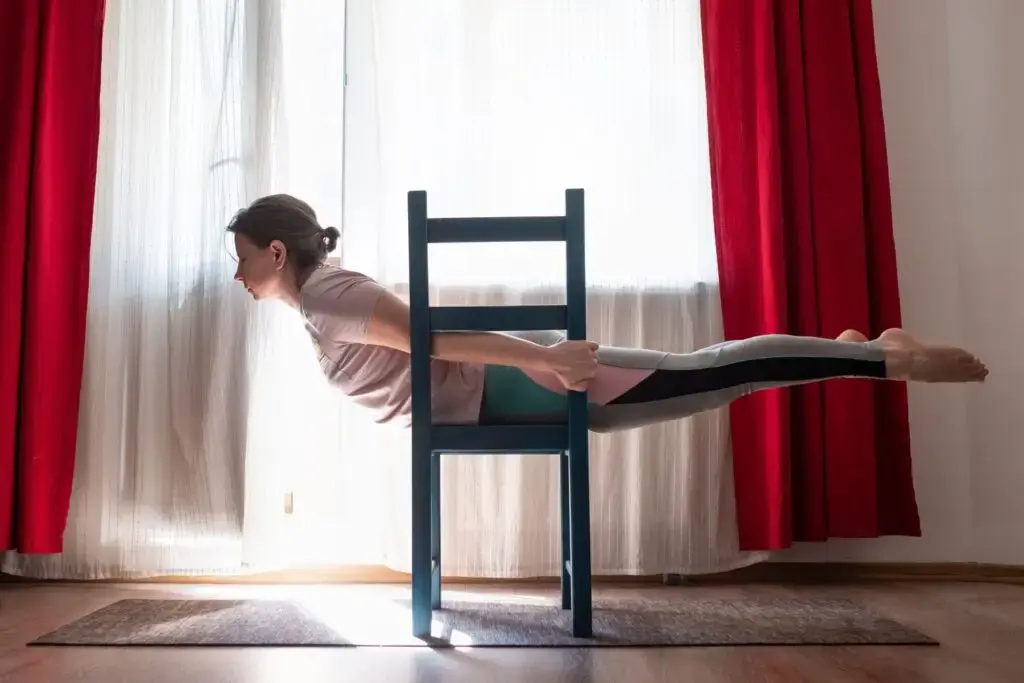 A woman doing the "Superman" exercise