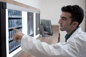 A doctor pointing to an x-ray